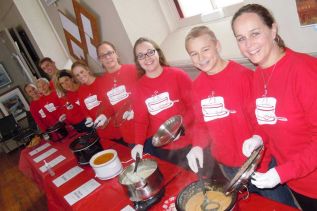 Volunteers ladle out 18 different kinds of soup at the Vision Soup fundraiser event held at Sydenham’s Grace Centre on November 28